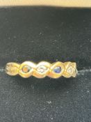 9ct Gold ring set with 3 sapphires & 2 diamonds Si