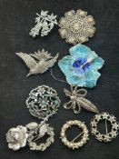 10 brooches