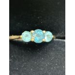 9ct Gold ring set with blue topaz & 2 light blue s