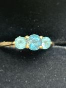 9ct Gold ring set with blue topaz & 2 light blue s