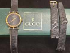 Ladies Gucci wristwatch with box & spare leather s