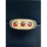 9ct Gold ring set with 3 red garnets Size W 3.3g