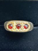 9ct Gold ring set with 3 red garnets Size W 3.3g
