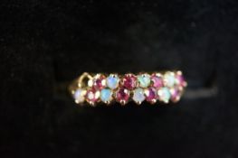 9ct Gold ring set with ruby & opal Size P (1 opal missing)