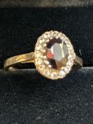 9ct gold ring set with red garnet & cz stones Size