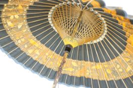 Oriental lacquered bamboo parasol