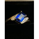 9ct Gold ring set with blue topaz & diamonds Size
