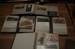 4 Albums of early postcards from the 19th century onwards, many with stamps - viewing recommended
