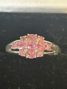 9ct White gold ring set with 11 pink sapphires & d