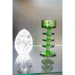 Green glass together with a paperweight