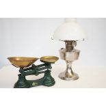 Parafin lamp together with a pair of scales