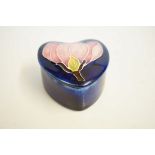 Moorcroft lidded pot pink magnolia - blue backgrou