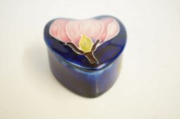 Moorcroft lidded pot pink magnolia - blue backgrou