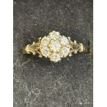 9ct gold cluster ring set with 7 white stones Size