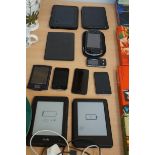 A collection of phones, kindle and others