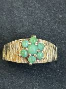 9ct gold ring set with green hard stones Size M -