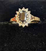 9ct gold ring set with sapphire(?) and white stone
