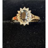 9ct gold ring set with sapphire(?) and white stone