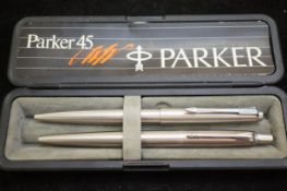 Two Parker ballpoint pens