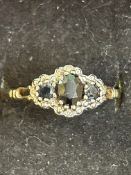9ct gold ring set with Sapphire and diamonds Size