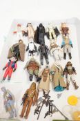 A collection of Star Wars figures from the 70s and