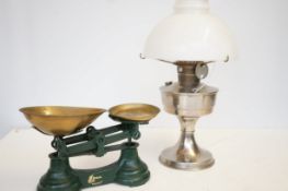 Parafin lamp together with a pair of scales