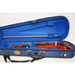 Cased violin with soft case