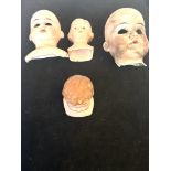 4 Old dolls heads