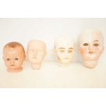 Bag of 4 old dolls heads