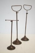 A good pair of late 19th century/early 20th century telescopic cast metal shop display or hat stands