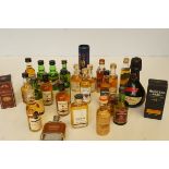 A collection of mainly miniature whiskeys to include Petite, Liquorelle, Moet and Chandon