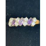 9ct Gold ring set with 3 amethyst & 8 white stones