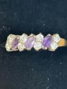 9ct Gold ring set with 3 amethyst & 8 white stones
