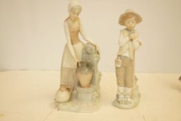 Two nayo figurines, largest 29cm