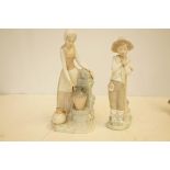 Two nayo figurines, largest 29cm