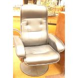 A large heated swivel massage chair