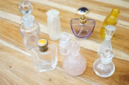 A collection of perfume bottles to include Baccara