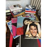 A collection of Elvis memorabilia to include records