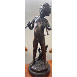 Large bronze signed figure of a young boy playing