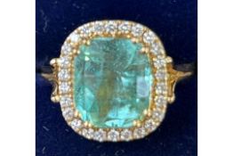 Colombian Emerald and diamond ring set in 18ct gol