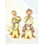 A pair of bisque figures, young girl & young boy s