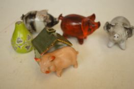 A collection of studio ceramic pigs