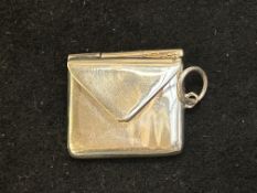 Silver stamp case in the form of an envelope