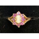 9ct Gold ring set with central opal & 8 amethyst S