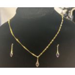 9ct Gold chain & pendant, pendant set with amethys