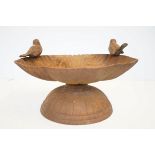 Edwardian cast iron bird bath featuring 2 birds, shell shaped bowl on circular base