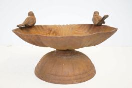 Edwardian cast iron bird bath featuring 2 birds, shell shaped bowl on circular base