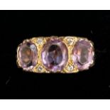 9ct Gold ring set with 3 large amethyst Size R 3.9