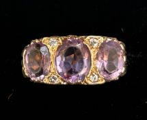 9ct Gold ring set with 3 large amethyst Size R 3.9