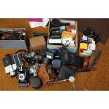 A collection of vintage cameras, recorder, lights,